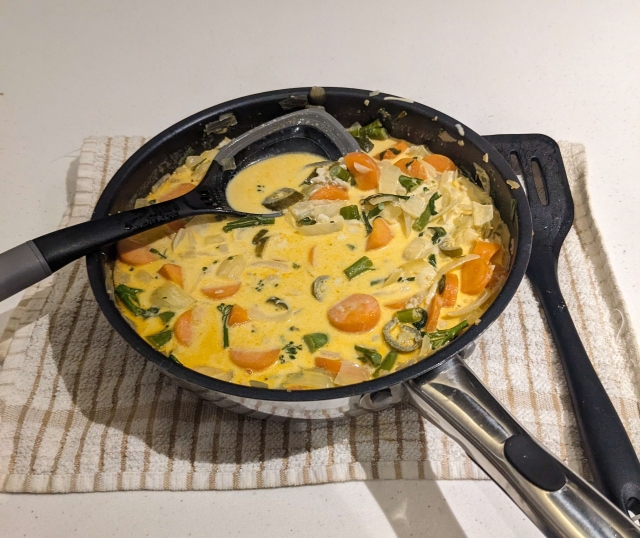 Spicy Cauldron Stew complete in pan with heavy cream